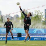 Powerful . . . New Zealand fistball player Josh Cameron prepares to deliver a spike as team-mate Kenny Baker watches on during the recent World Games